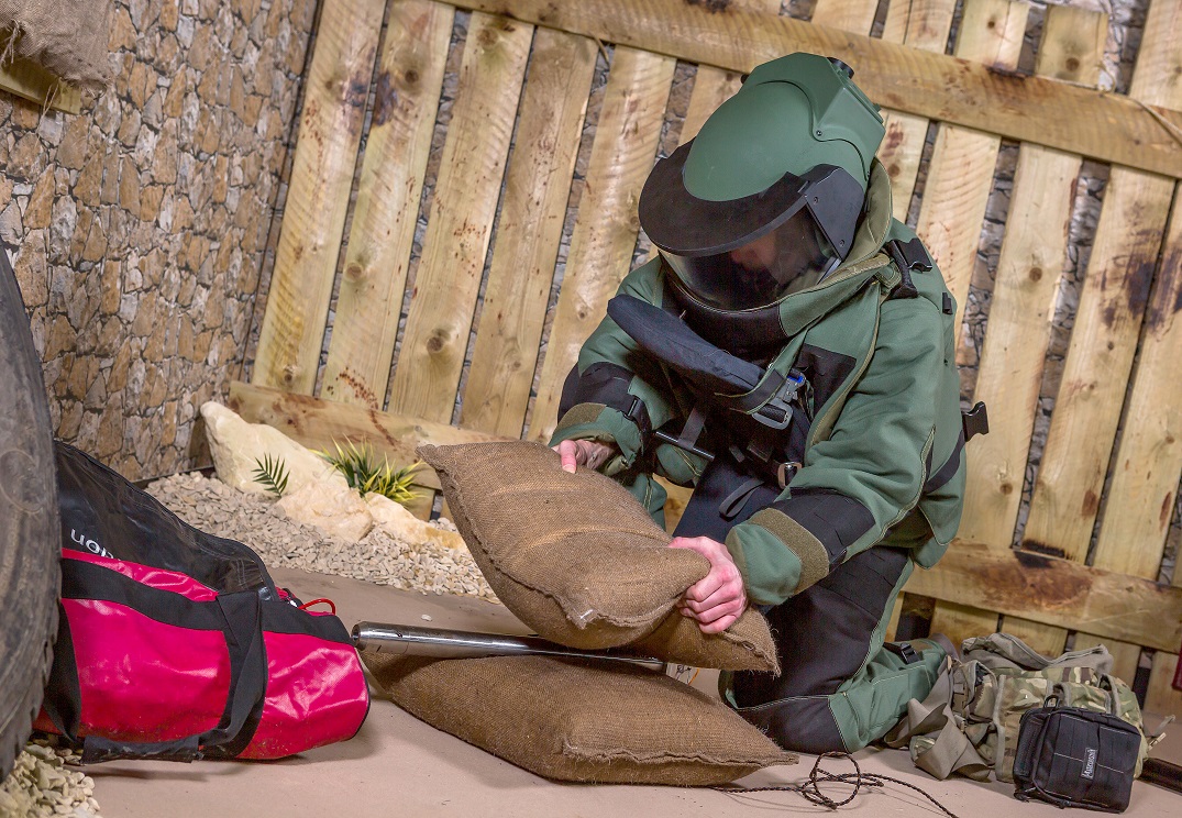 A soldier showing the effectiveness of BlastSax alternative sandbags at the British Army showcase at Larkhill near Salisbury in Wiltshire. resized.jpg